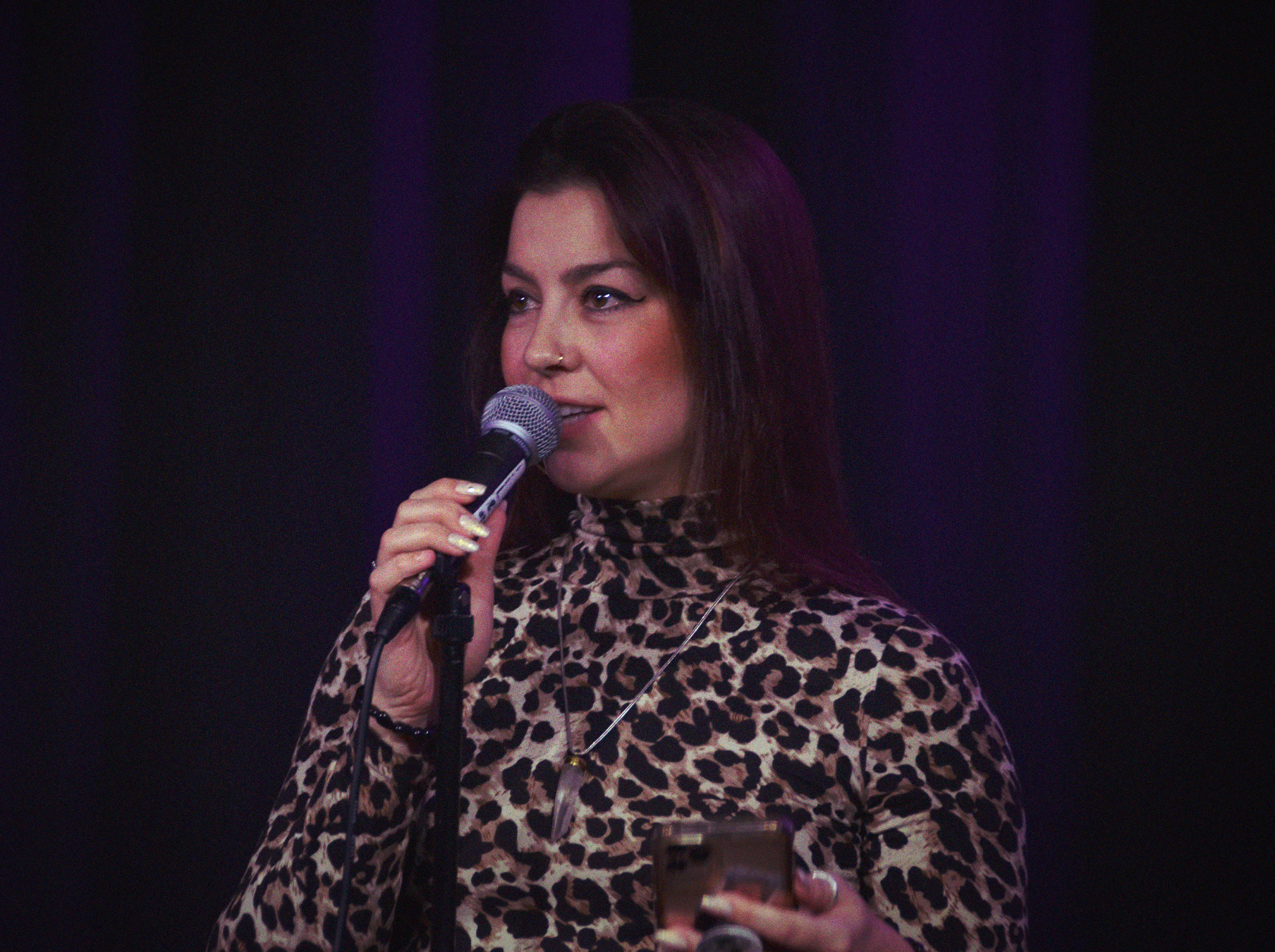 someone is talking on a microphone